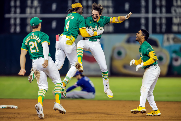 Oakland Athletics players celebrate on the field