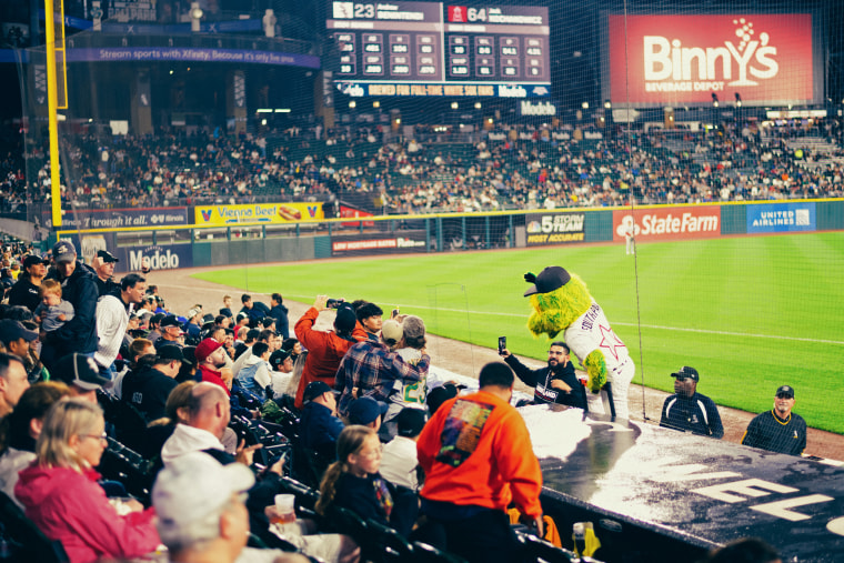 The crowd gathers around Southpaw, the Sox mascot.