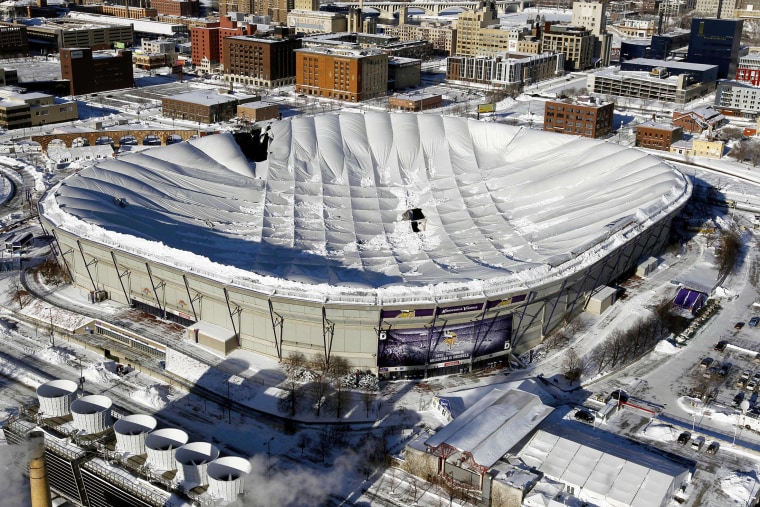 In a Dec. 12, 2010 file photo, holes in the collapsed Metrodome roof can be seen in Minneapolis.