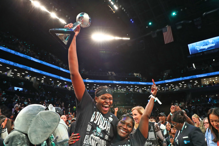 Jonquel Jones of the New York Liberty celebrates with the 2024 WNBA Finals MVP trophy.