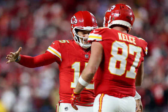 Patrick Mahomes #15 of the Kansas City Chiefs celebrates with Travis Kelce #87.