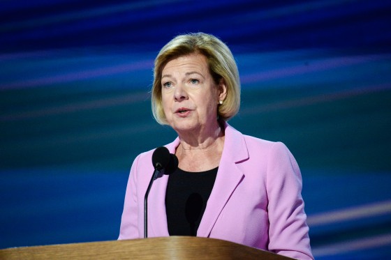 Tammy Baldwin speaks at a podium on stage