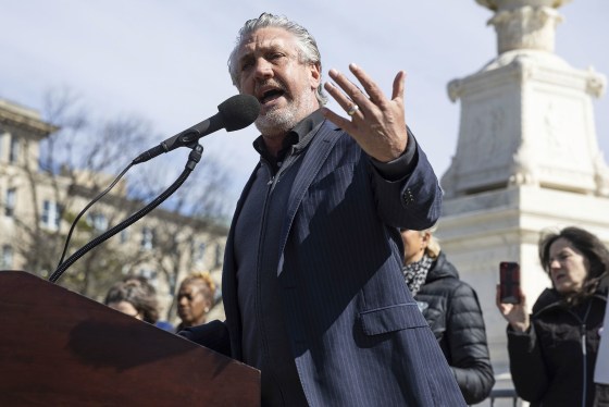 Anti-vaccine activist Del Bigtree speaks at a rally outside the Supreme Court