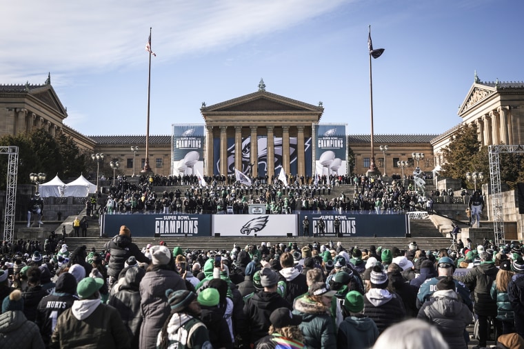 Fans listen at the base of the Philadelphia Art Museum during the Philadelphia Eagles' NFL football Super Bowl 59 parade