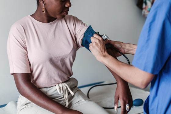 240131-stock-black-woman-blood-pressure-ew-1200p-0df009-1 Nurse checking blood pressure of female patient in clinic