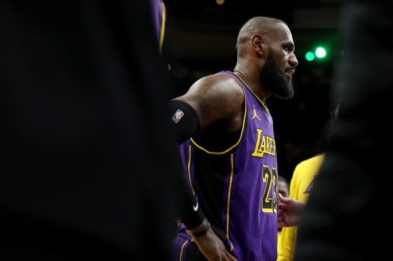 LeBron James #23 of the Los Angeles Lakers leaves the game after an injury during the second half against the Boston Celtics at TD Garden on Saturday.